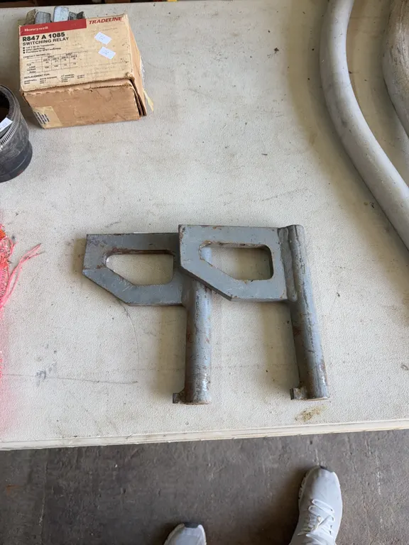 Two steel brackets