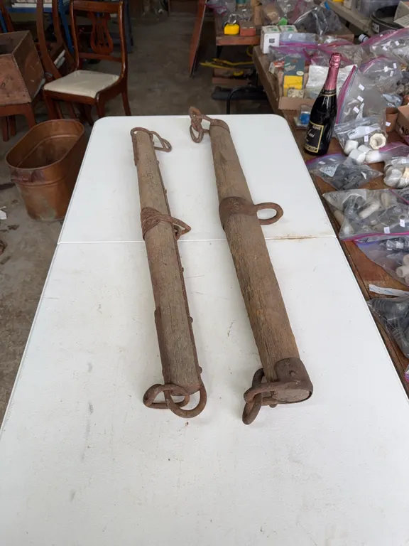 2 wooden single trees