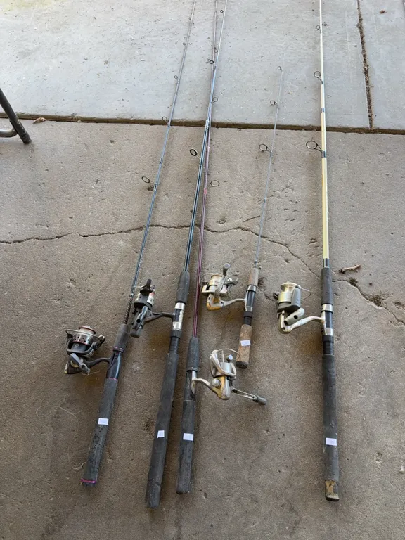 5 fishing poles with reels
