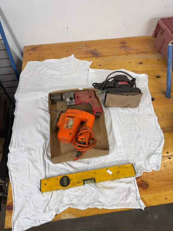 Sears belt sander, Milwaukee power drill, Black & Decker, jigsaw, 16 inch level