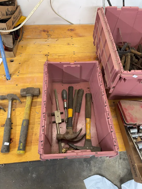 Six Hammers in a plastic storage container