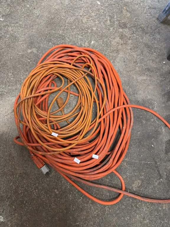 One heavy gauge extension, cord, one light duty extension cord