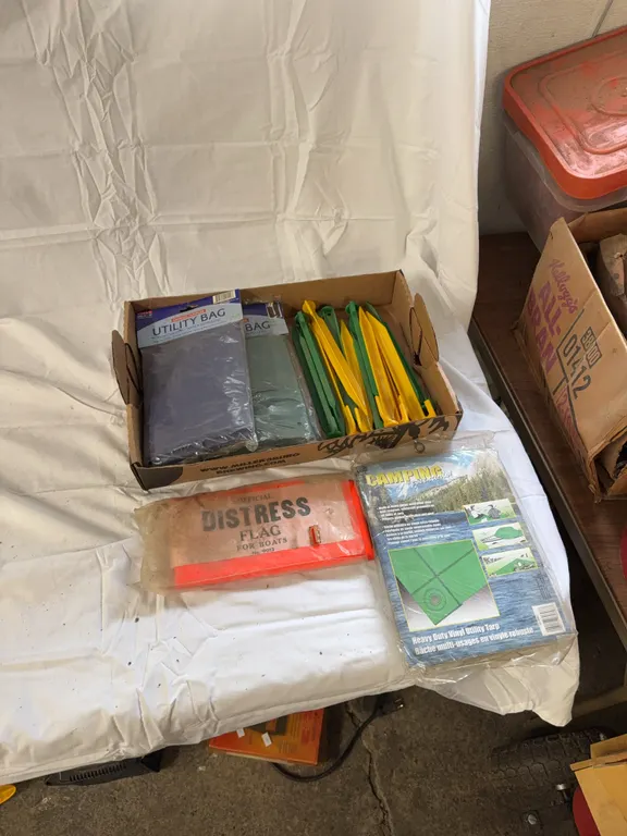 Waterproof utility tarps, stakes, distress flags ?