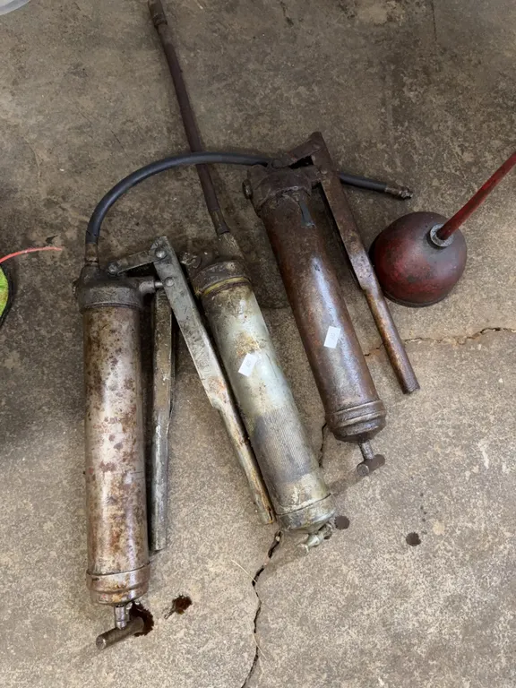 Three grease guns oiler