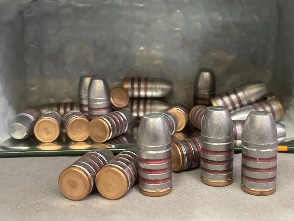 Tin of 25 .45 cal. bullets. 300 gr.