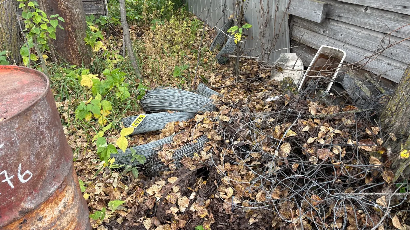 6- Rolls of wire, 2- Barrels, propane tank, misc. wire