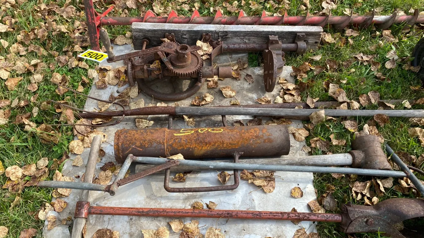 Contents on Pallet- Fork, auger, sledge, post driver, post drill, plastic hopper & spreader
