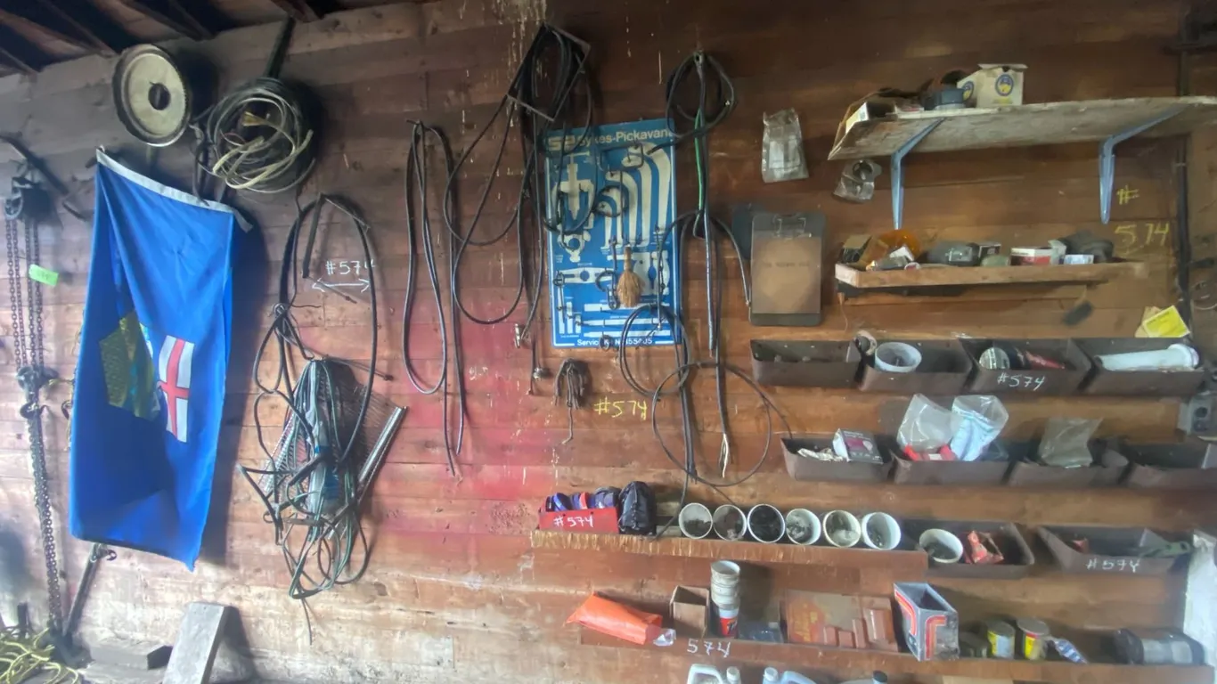 Large amount of Misc. in garage (hanging on West wall), Alberta flag, large of misc.