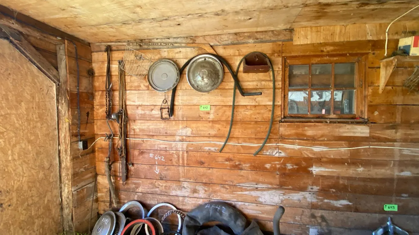 Various hub caps, auto parts & wire stretcher