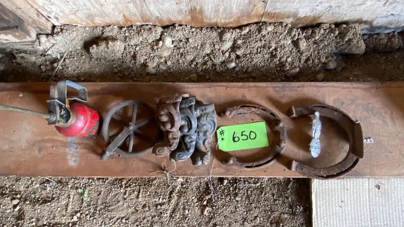 Horse shoes, case emblem, 3- stove legs, oil can etc.