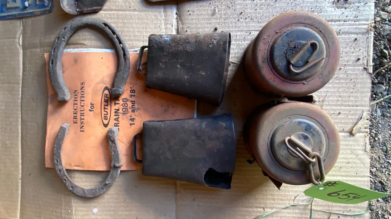 2- Cow bells, 2- Horse shoes, Butler instruction book & 2- road flares