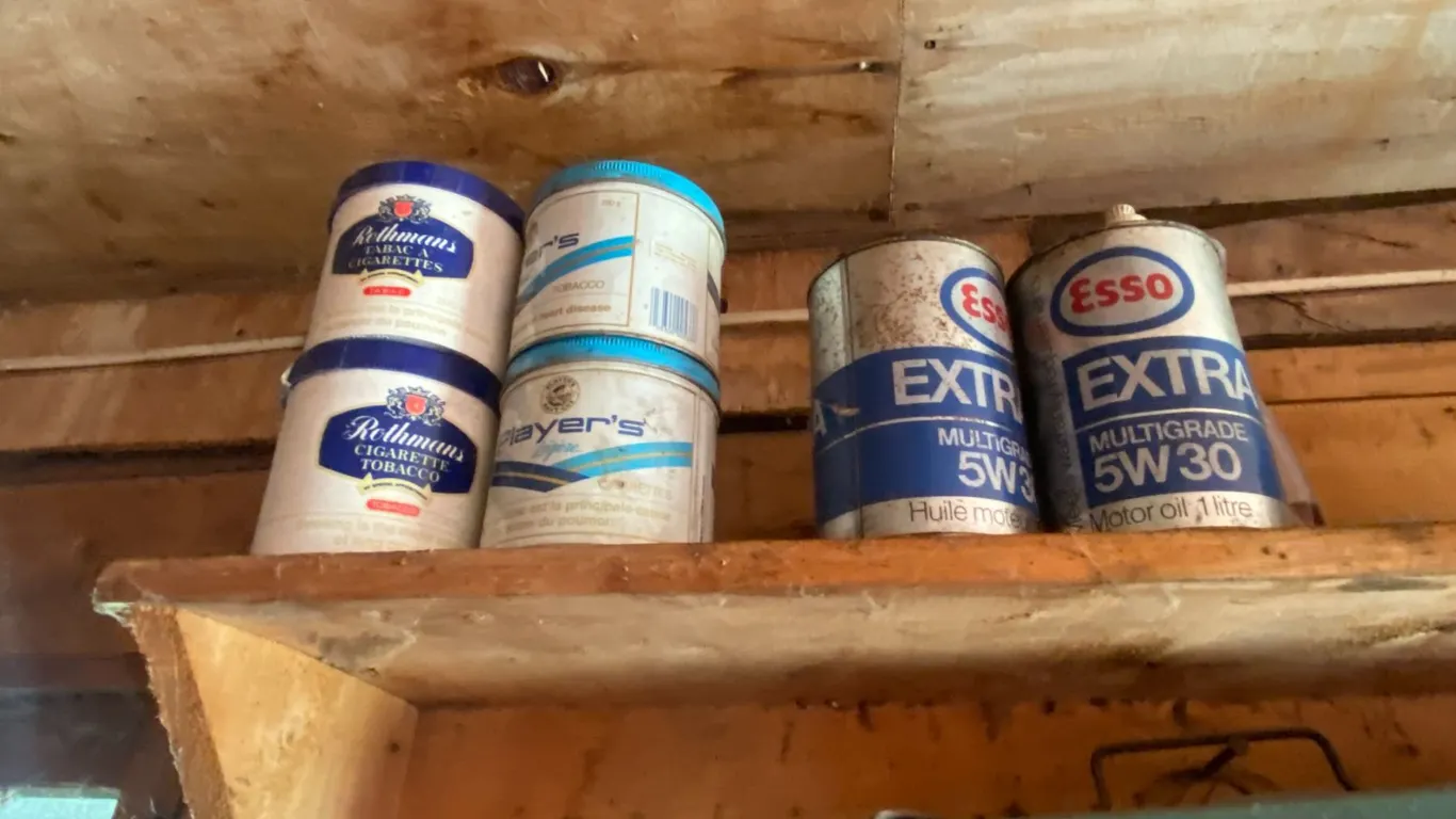 Various tins, bottles & camp stove