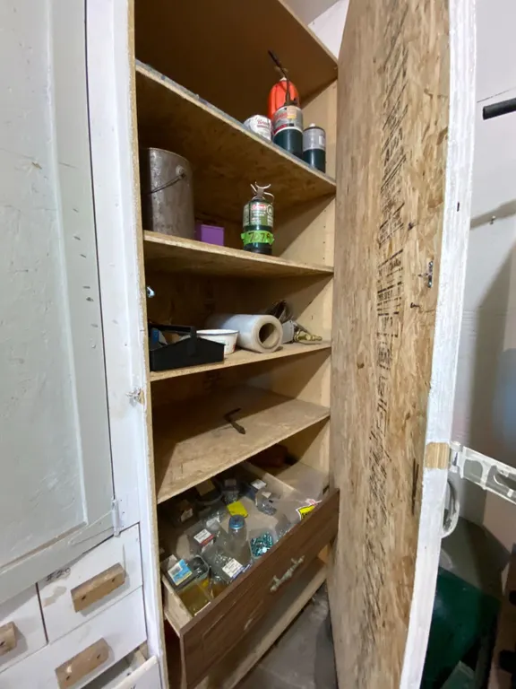 Screws, poly tanks, contents on shelf