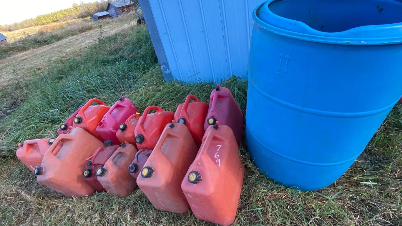Approx. 14- Jerry cans & blue barrel