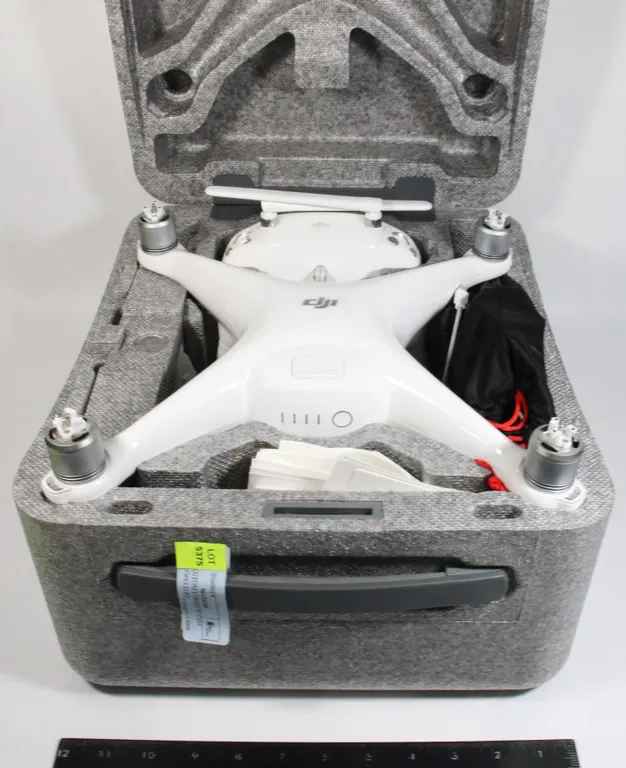 DJI PHANTOM 4 DRONE W/ CASE AND PROPELLORS
