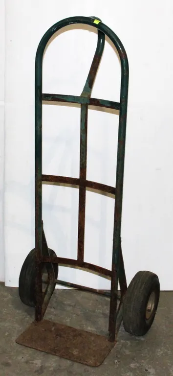 GREEN DOLLY, SOME RUST, SOLD AS IS
