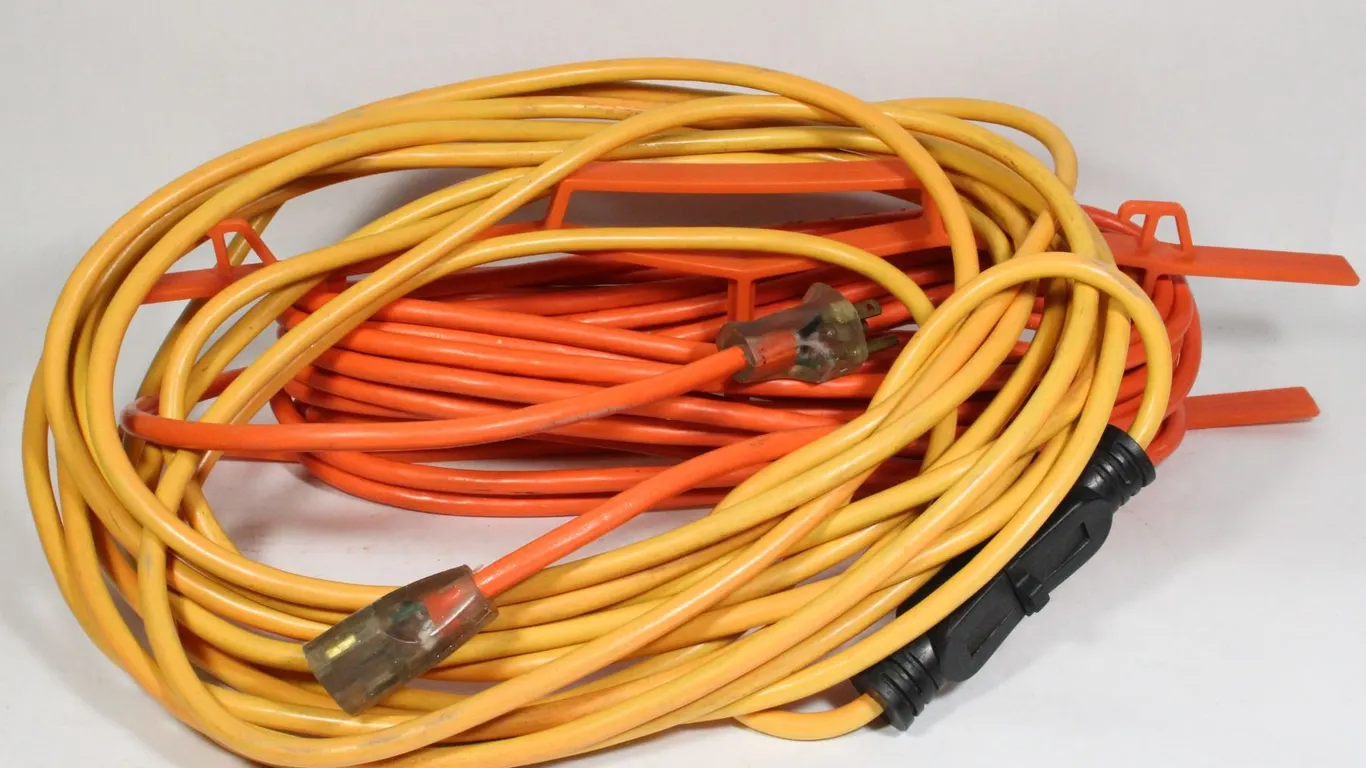 TWO EXTENSION CABLES, ONE HAS SIMPLE HOLDER