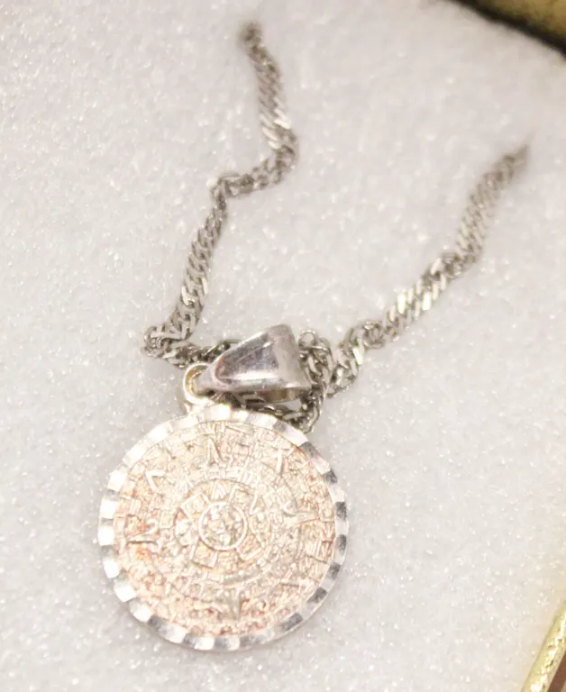 SILVER TONED AZTEC MEDALLION NECKLACE