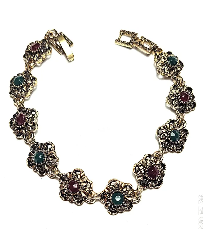 14) ANTIQUED GOLD TONE WITH EMERALD