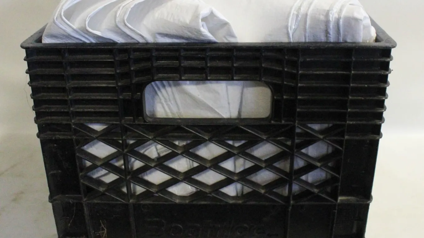 3 - 7' X 9' WHITE TARPS IN A MILK CRATE