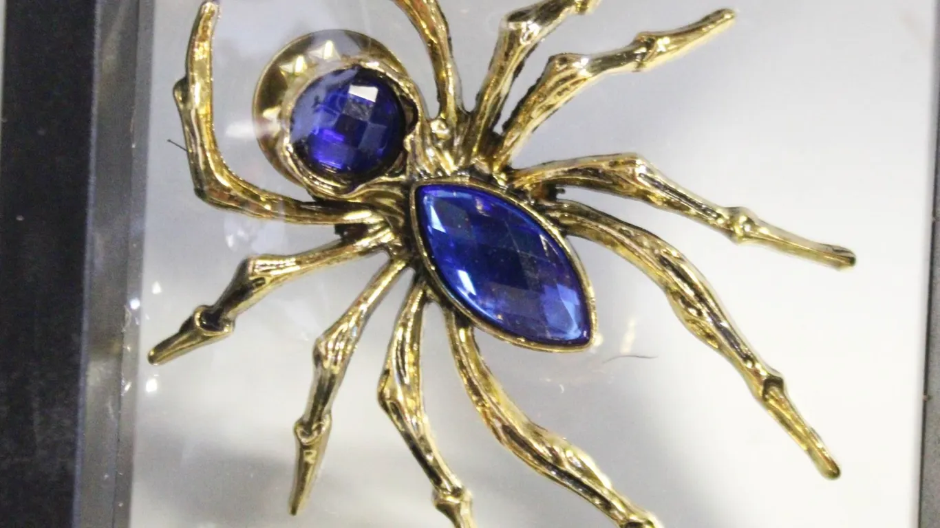 NEW GOLD TONE SPIDER WITH BLUE