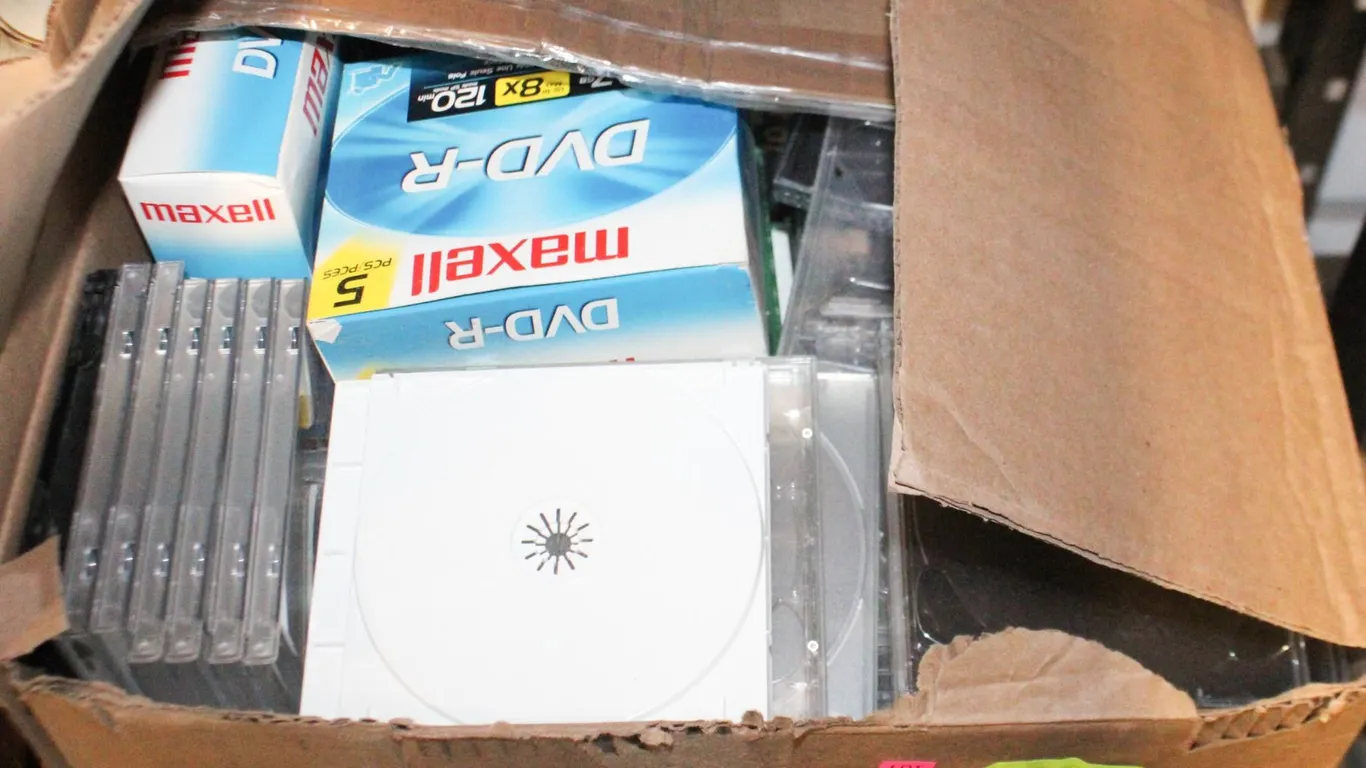 BOX OF BLANK DVD’S AND CASES