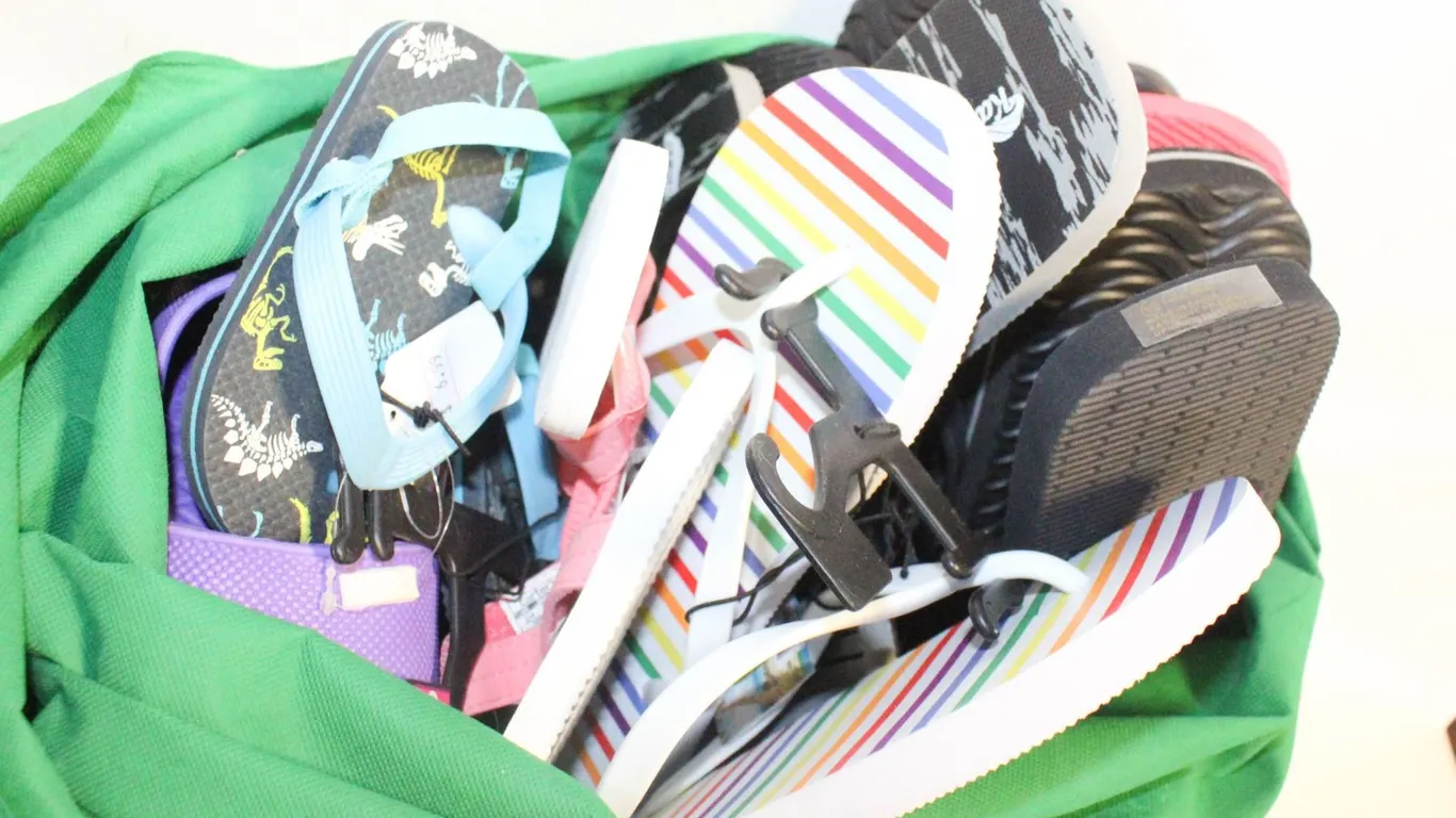 BAG OF NEW SHOES AND FLIP FLOPS VARIOUS SIZES