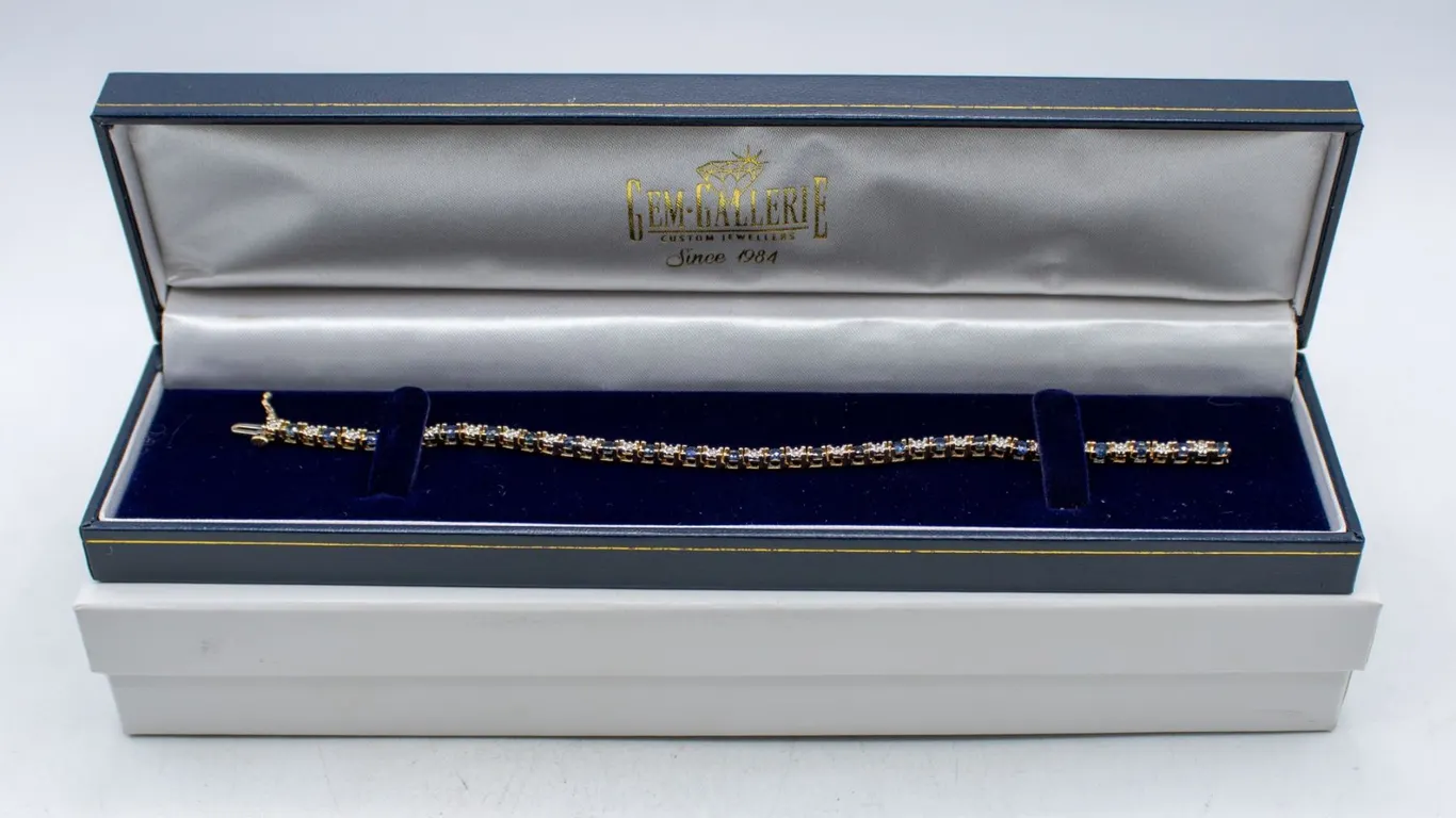 14K YELLOW GOLD TENNIS BRACELET WITH 24 ROUND