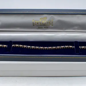 14K YELLOW GOLD TENNIS BRACELET WITH 24 ROUND