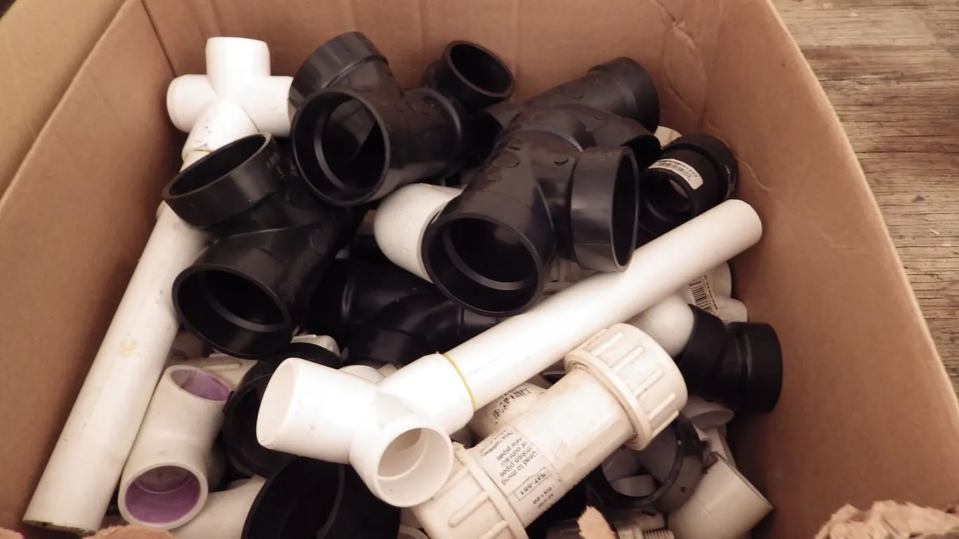 Box of ABS and PVC pipe fittings