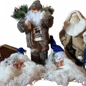 Christmas Decorations Including Santa Figures, Nativity Scene, and Snowman Jar