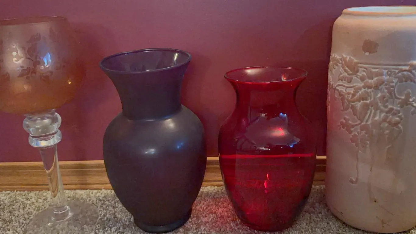 Four Decorative Vases: Glass, Ceramic, and Embossed Floral Designs
