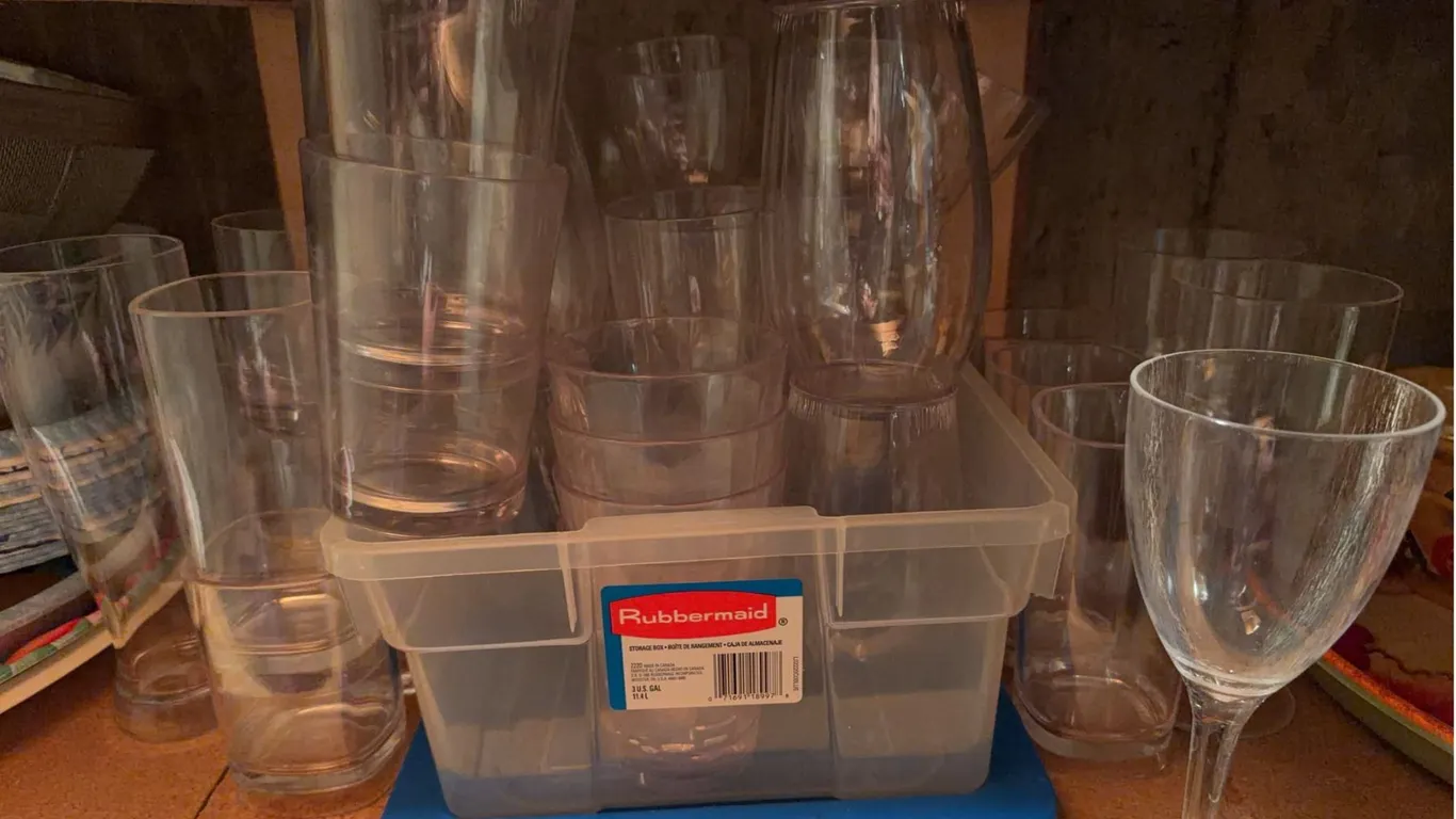 Clear Glass Drinkware Including Tumblers and Wine Glasses with Rubbermaid Bin