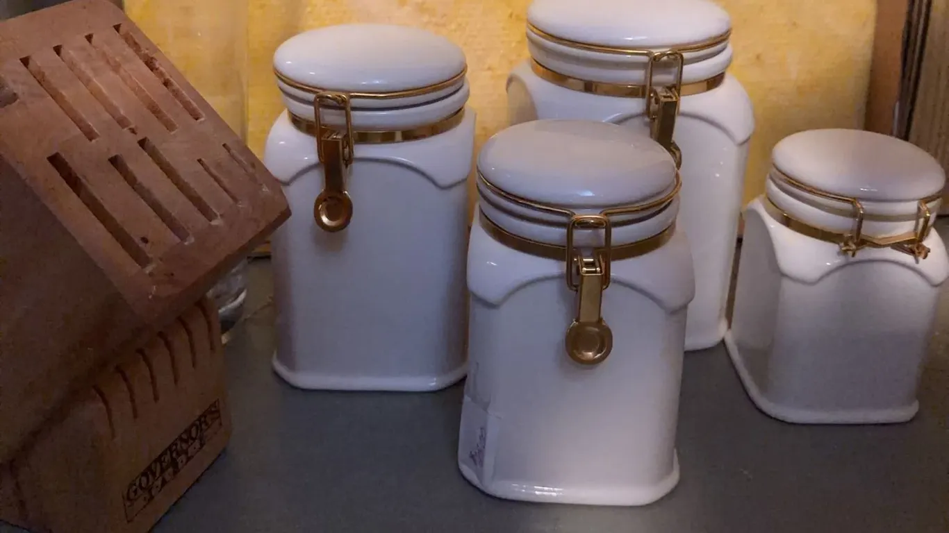 4 White Ceramic Canisters with Gold Hinged Lids and Wooden Knife Block
