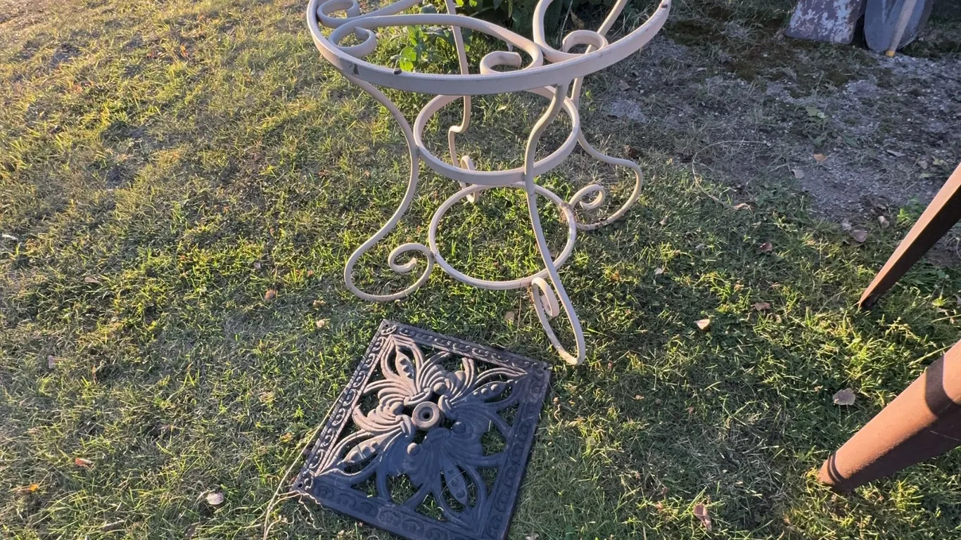 Decorative Metal Plant Stand With Scrollwork and Black Ornate Metal Grate