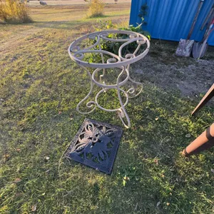 Decorative Metal Plant Stand With Scrollwork and Black Ornate Metal Grate