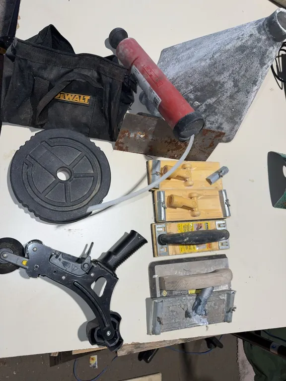 Lot with DeWalt Tool Bag, Cast Iron Weights, Hand Trowels, Caulking Gun
