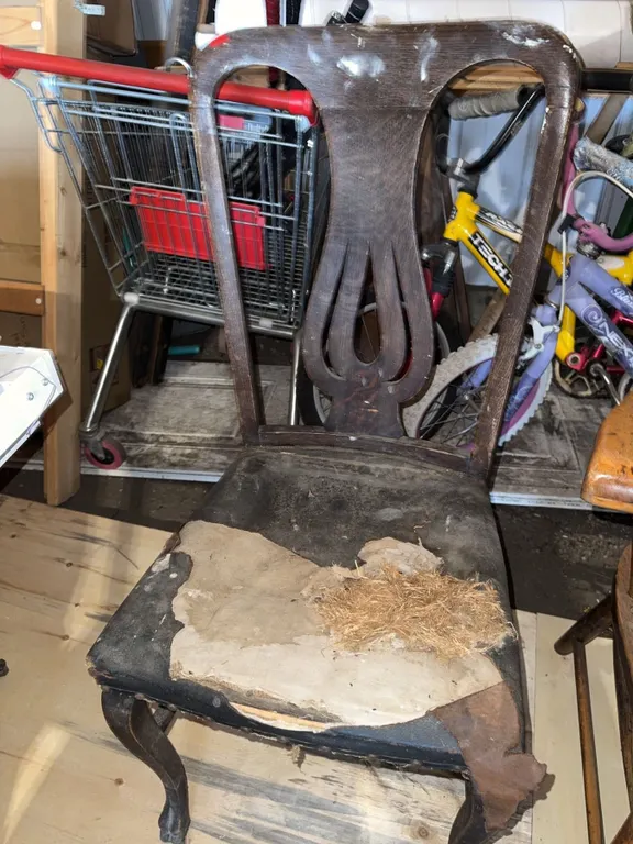 Wooden Chair with Decorative Backrest and Damaged Upholstery