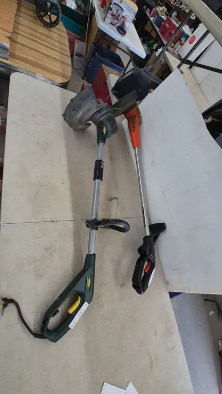 Two String Trimmers: Green Works 21212 and Black+Decker LST136 String Trimmer