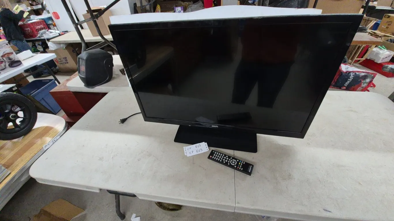 Technicolor TC3205A 32” LCD TV, Remote Control, and Power Cord