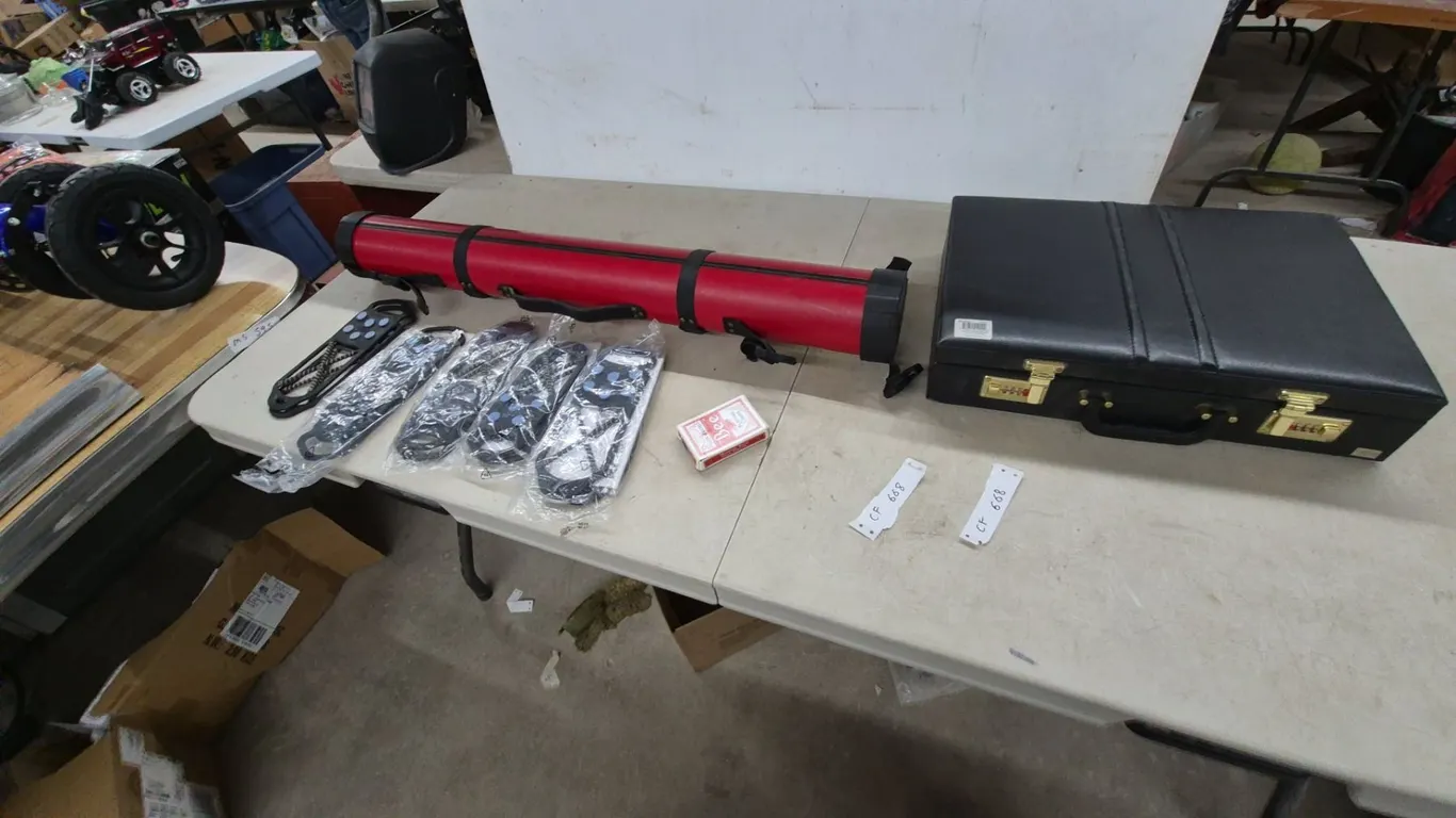 Red fishing rod Tube Case, Black Briefcase, 4 Pkgs Ice Grips, and Bee Playing Cards