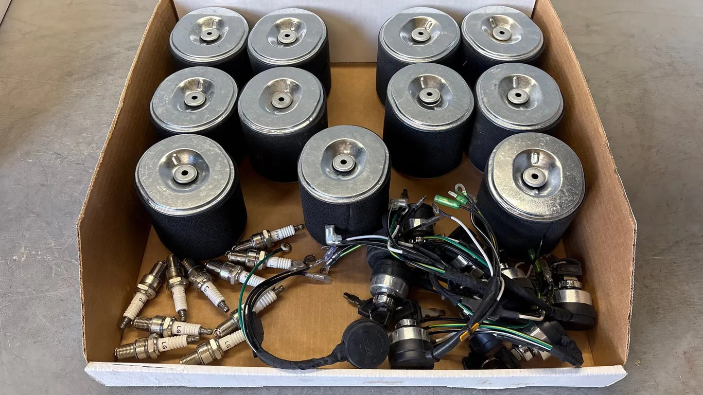 Box of Air Filters, Ignition Switches and Spark Plugs