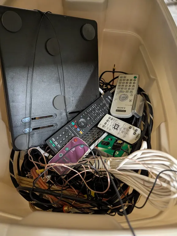 Assorted Electronic Remotes And Cables