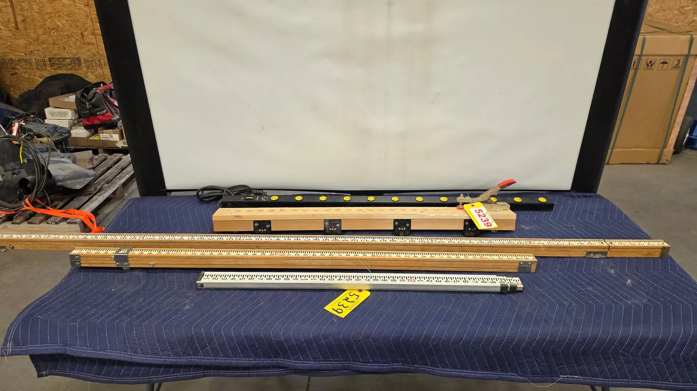 Assorted Measuring Tools And Power Strip