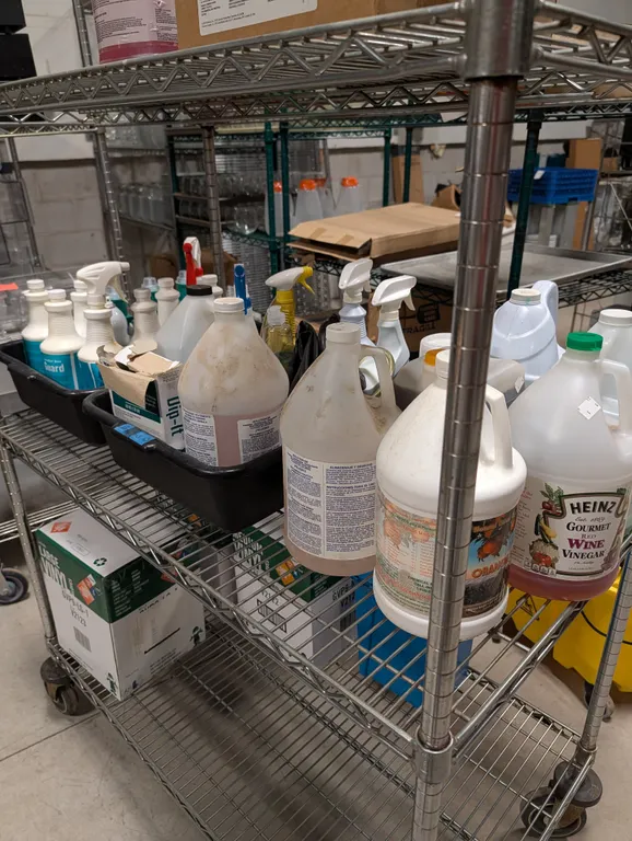 Shelf with Assorted Cleaning Chemicals (Shelving Unit Not Included)