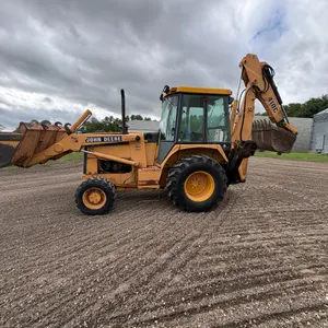 JD 410 C 4wd backhoe. Has turbo diesel engine and enclosed cab.  Front loader bucket with rear extend-a-hoe with toothed bucket. Good heavy tires and 