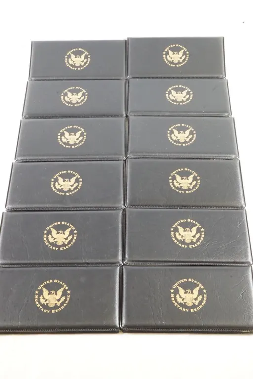 Lot of (12) Uncirculated 2003 $2 Bills in Cases