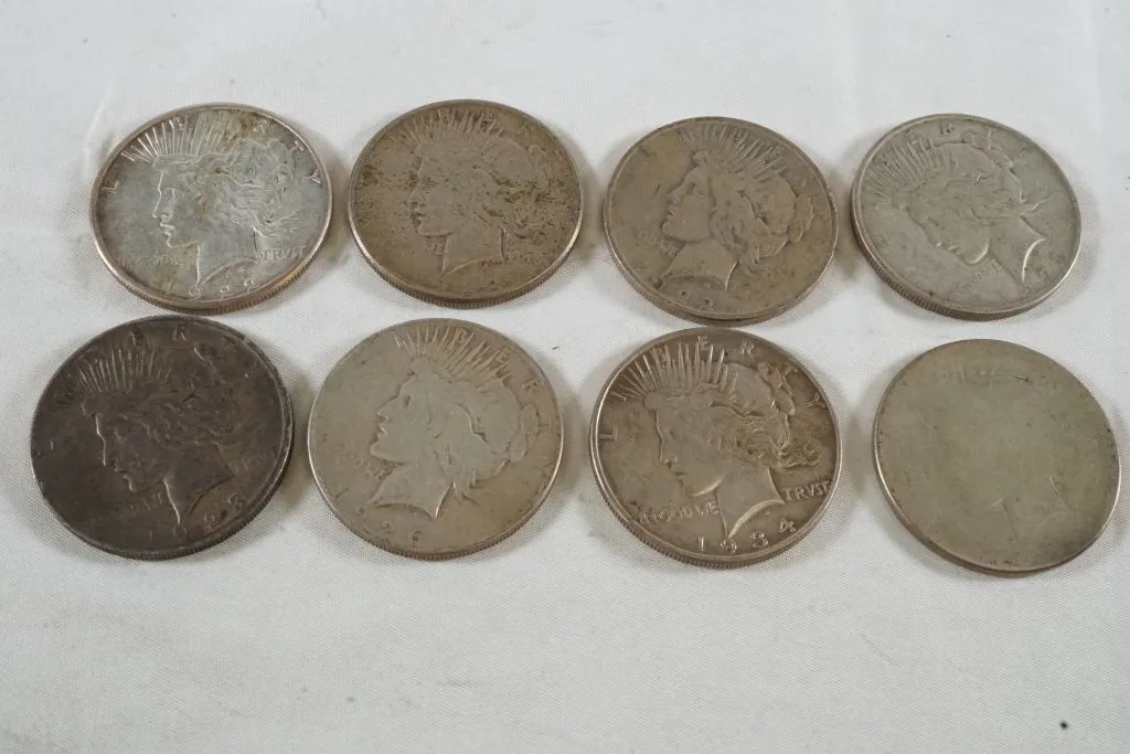 Lot of (8) Peace Dollars