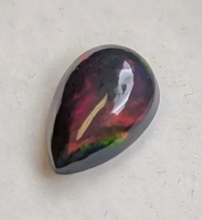 2.33 CT CERTIFIED BLACK OPAL GEMSTONE ($1,850 APPRAISAL)
