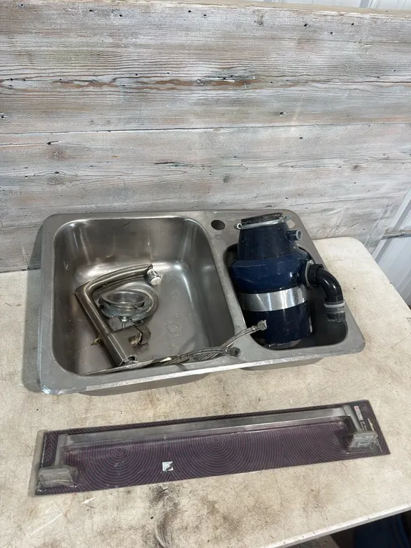 Stainless steel sink with garburator